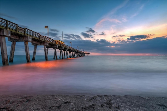 dock area featuring a pier and a water view