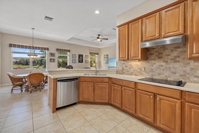 kitchen featuring visible vents, under cabinet range hood, a sink, black electric stovetop, and dishwasher