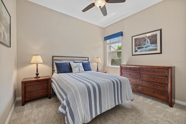 bedroom with baseboards, light carpet, and a ceiling fan