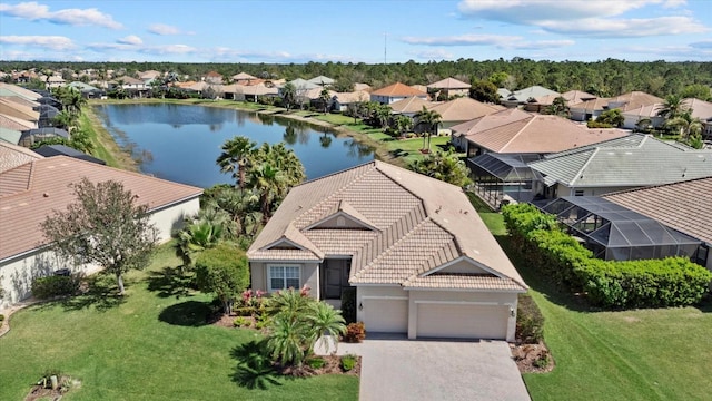 birds eye view of property featuring a residential view and a water view