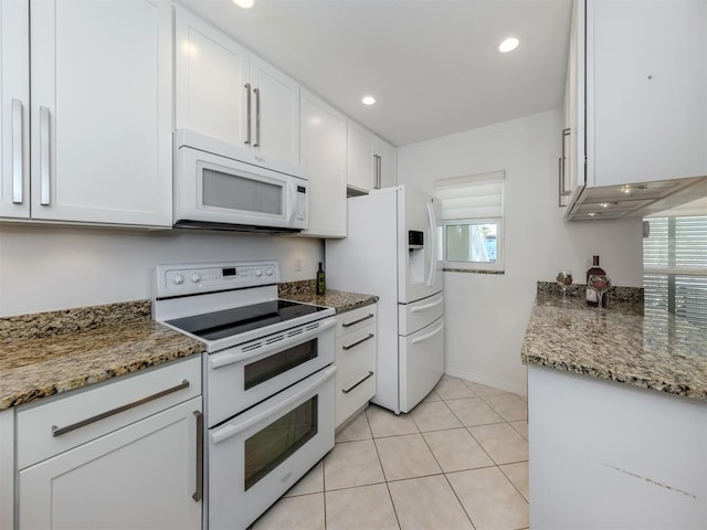 kitchen featuring light stone counters, recessed lighting, light tile patterned flooring, white appliances, and white cabinetry