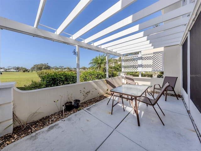 view of patio / terrace featuring a pergola and outdoor dining area