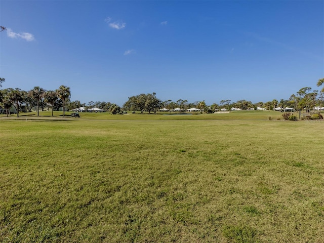 view of home's community featuring a lawn