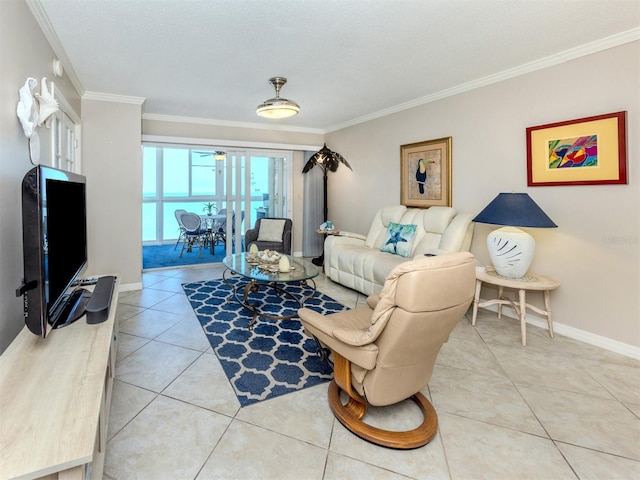 living area featuring light tile patterned flooring, baseboards, and ornamental molding