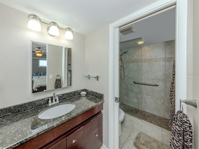 bathroom with vanity, visible vents, a stall shower, ensuite bathroom, and toilet