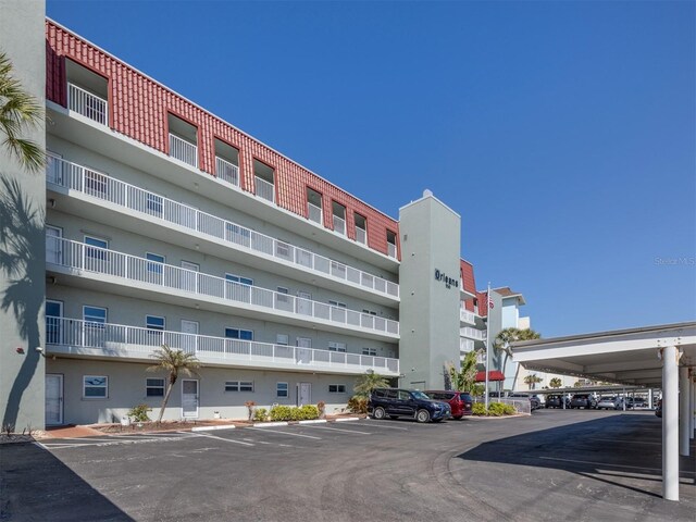 view of property featuring uncovered parking