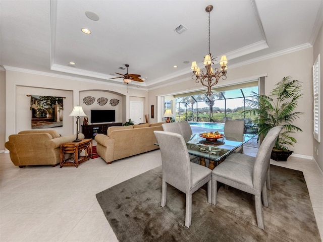 dining room featuring light tile patterned floors, visible vents, crown molding, and a raised ceiling