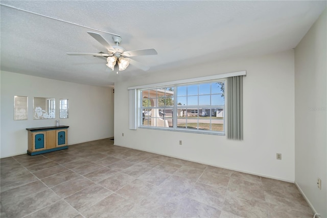358 Pineview Dr, Venice, FL 34293 - spare room with a ceiling fan and a textured ceiling
