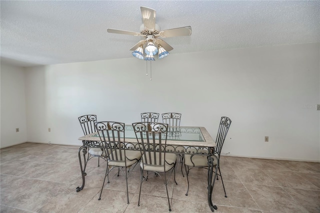 358 Pineview Dr, Venice, FL 34293 - dining room featuring a textured ceiling and a ceiling fan