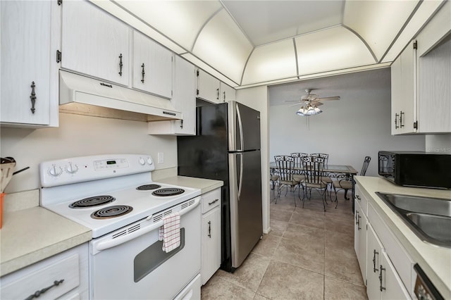 358 Pineview Dr, Venice, FL 34293 - kitchen with ceiling fan, black microwave, under cabinet range hood, white range with electric stovetop, and a sink
