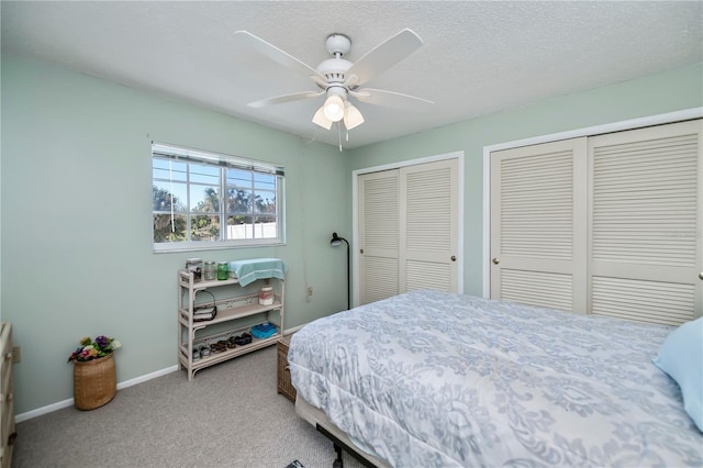 358 Pineview Dr, Venice, FL 34293 - carpeted bedroom with ceiling fan, baseboards, multiple closets, and a textured ceiling