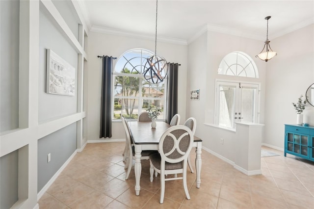 dining room with an inviting chandelier, crown molding, and a healthy amount of sunlight