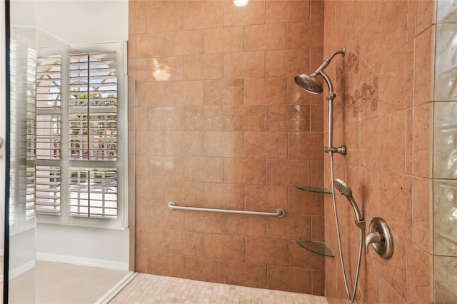 full bath featuring a tile shower