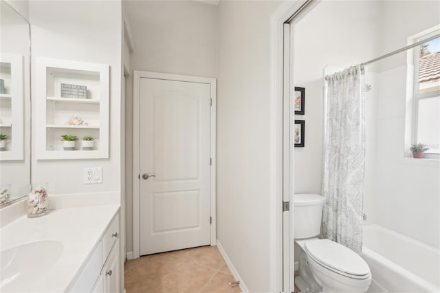 bathroom featuring tile patterned flooring, toilet, vanity, and shower / bath combo