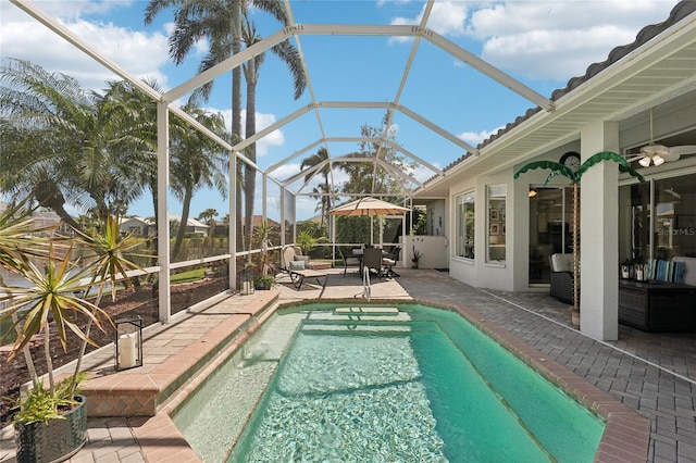 outdoor pool featuring a patio area and ceiling fan