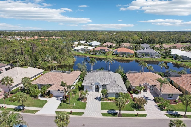 birds eye view of property featuring a residential view and a water view