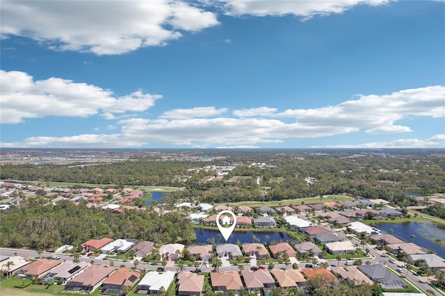 bird's eye view featuring a residential view and a water view