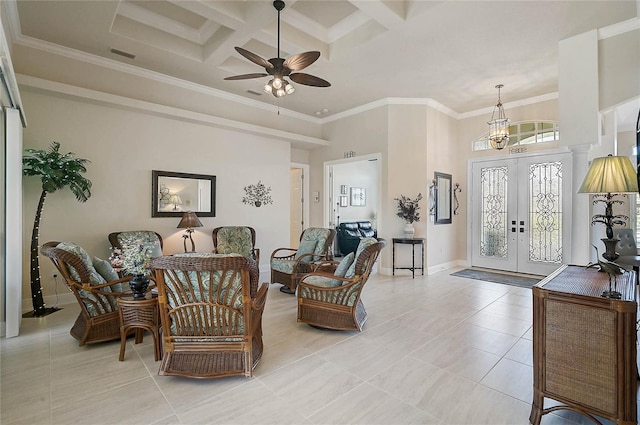 interior space featuring visible vents, crown molding, ceiling fan with notable chandelier, french doors, and a towering ceiling