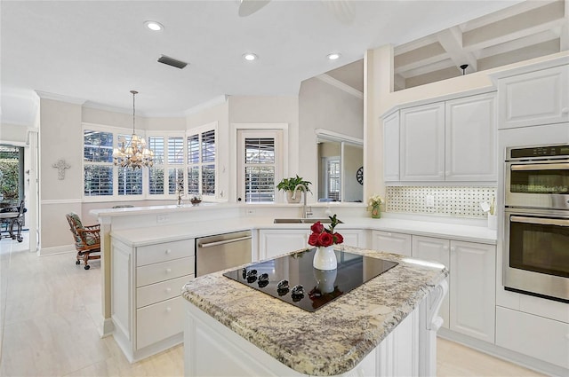 kitchen with a sink, visible vents, plenty of natural light, and appliances with stainless steel finishes