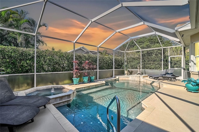 outdoor pool featuring an in ground hot tub and a patio area