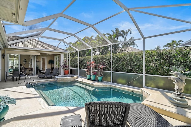 view of swimming pool featuring a pool with connected hot tub and a patio