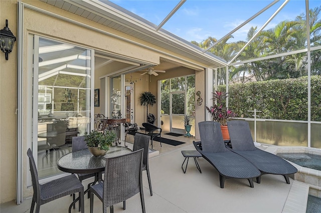 sunroom / solarium featuring ceiling fan