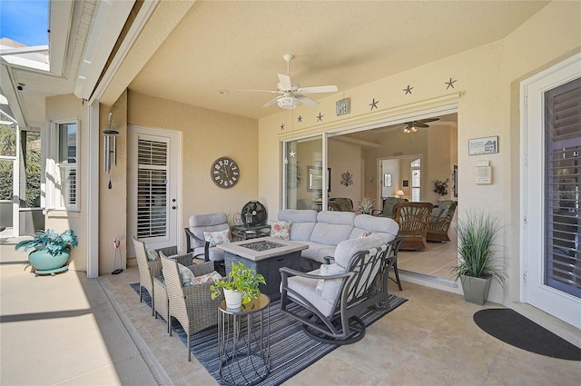 view of patio / terrace featuring an outdoor living space with a fire pit, a lanai, a ceiling fan, and visible vents