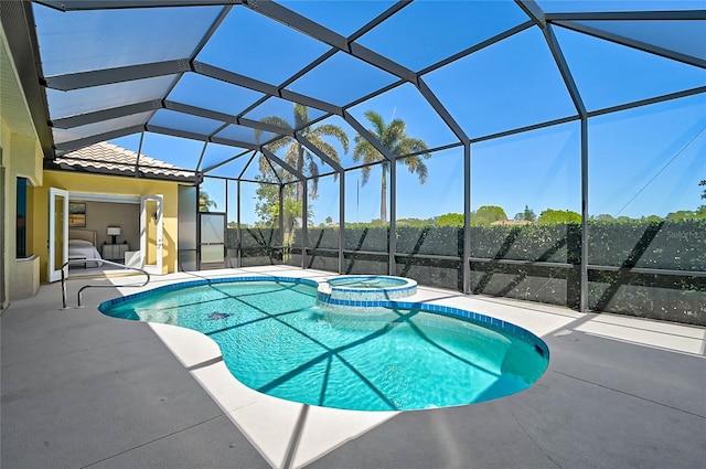 view of swimming pool with glass enclosure, a pool with connected hot tub, and a patio