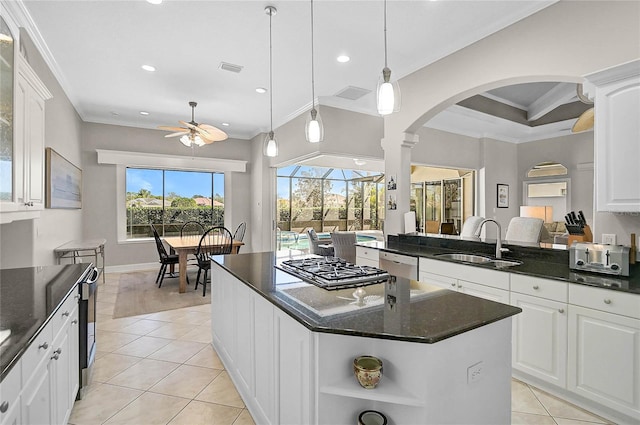 kitchen with ornamental molding, a ceiling fan, a sink, open shelves, and dishwashing machine