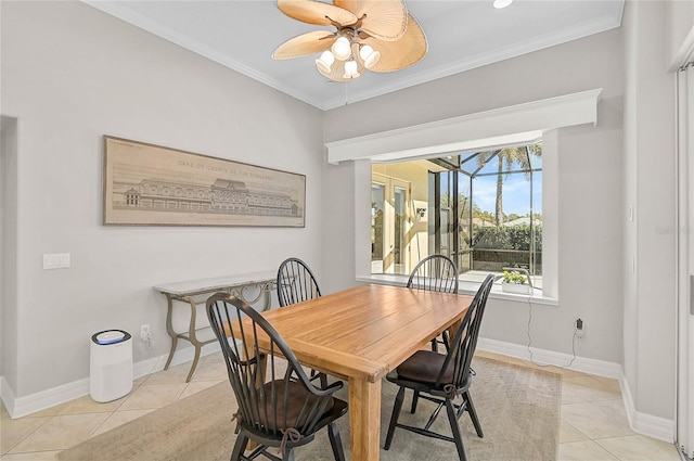 dining space featuring light tile patterned flooring, baseboards, a ceiling fan, and ornamental molding