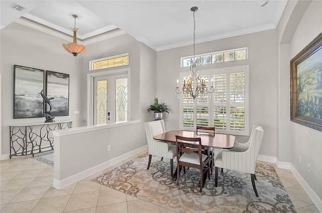 dining space featuring light tile patterned floors, visible vents, baseboards, and ornamental molding