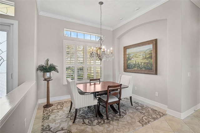 dining space with light tile patterned floors, baseboards, and crown molding