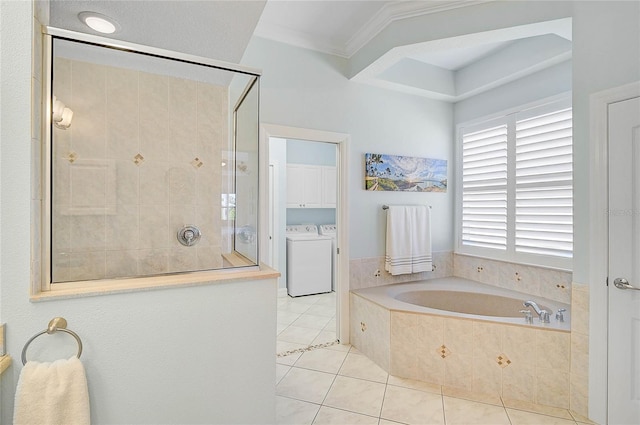 full bath with tiled shower, crown molding, washer and dryer, a garden tub, and tile patterned floors