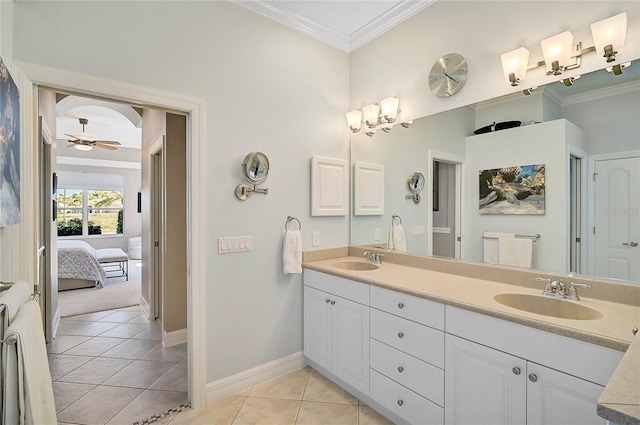 bathroom featuring a sink, double vanity, ornamental molding, and tile patterned floors