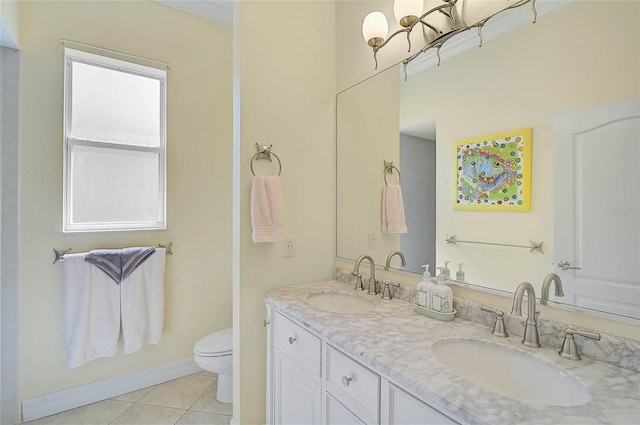 full bath featuring tile patterned flooring, double vanity, toilet, and a sink