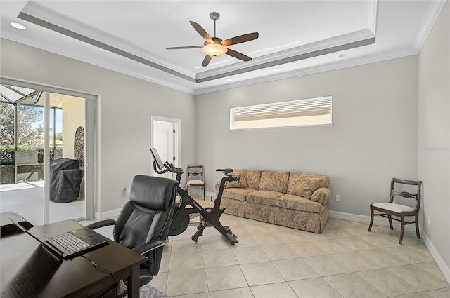 home office featuring a raised ceiling, baseboards, and ceiling fan