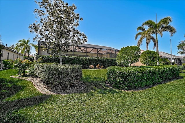 view of yard featuring a lanai