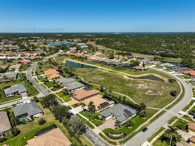 bird's eye view featuring a residential view, view of golf course, and a water view