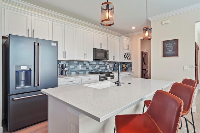 kitchen with white cabinets, black microwave, crown molding, decorative backsplash, and refrigerator with ice dispenser