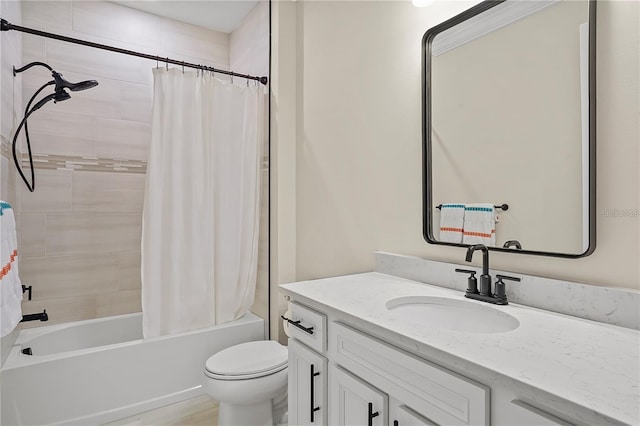 full bathroom featuring shower / bath combo, toilet, and vanity