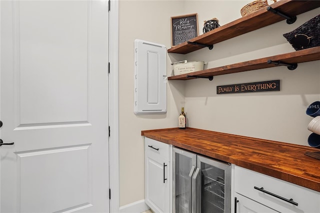 bar featuring a bar and wine cooler