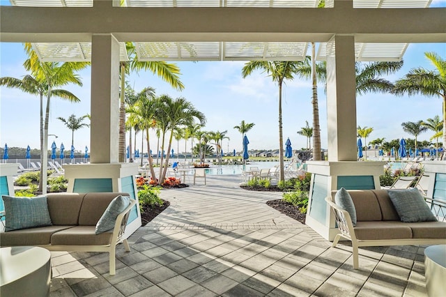 view of patio with an outdoor hangout area and a water view
