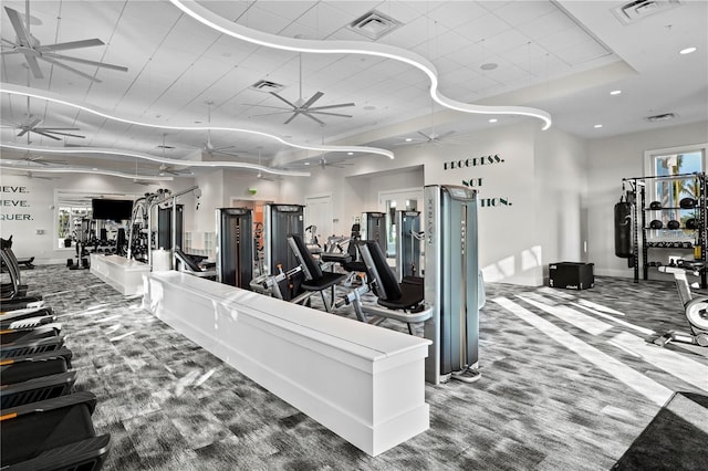 gym featuring baseboards, a ceiling fan, visible vents, and recessed lighting
