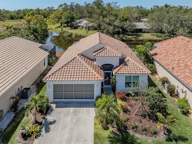 birds eye view of property featuring a water view