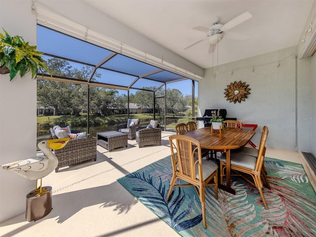 view of patio / terrace featuring a lanai, outdoor dining area, ceiling fan, and outdoor lounge area