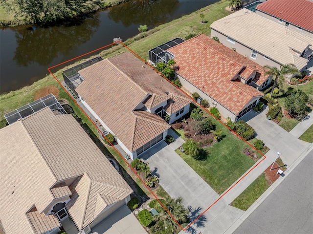 birds eye view of property featuring a water view