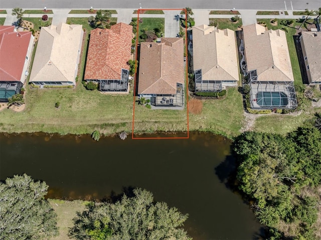 birds eye view of property with a residential view and a water view