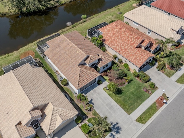 birds eye view of property featuring a water view