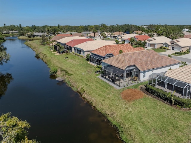 bird's eye view featuring a residential view and a water view