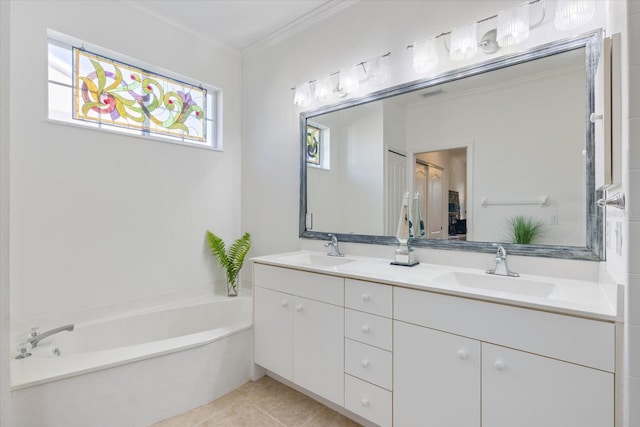 bathroom with double vanity, a garden tub, tile patterned floors, and a sink